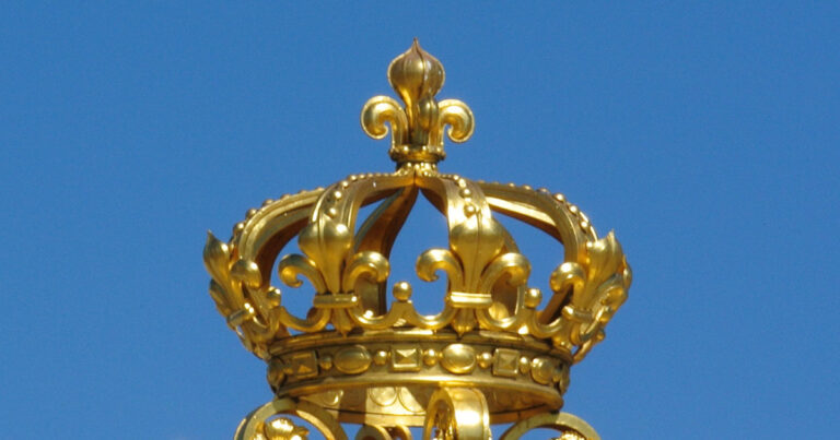 Gilded crown atop the reconstructed Gate of Honour at the Chateau de Versailles