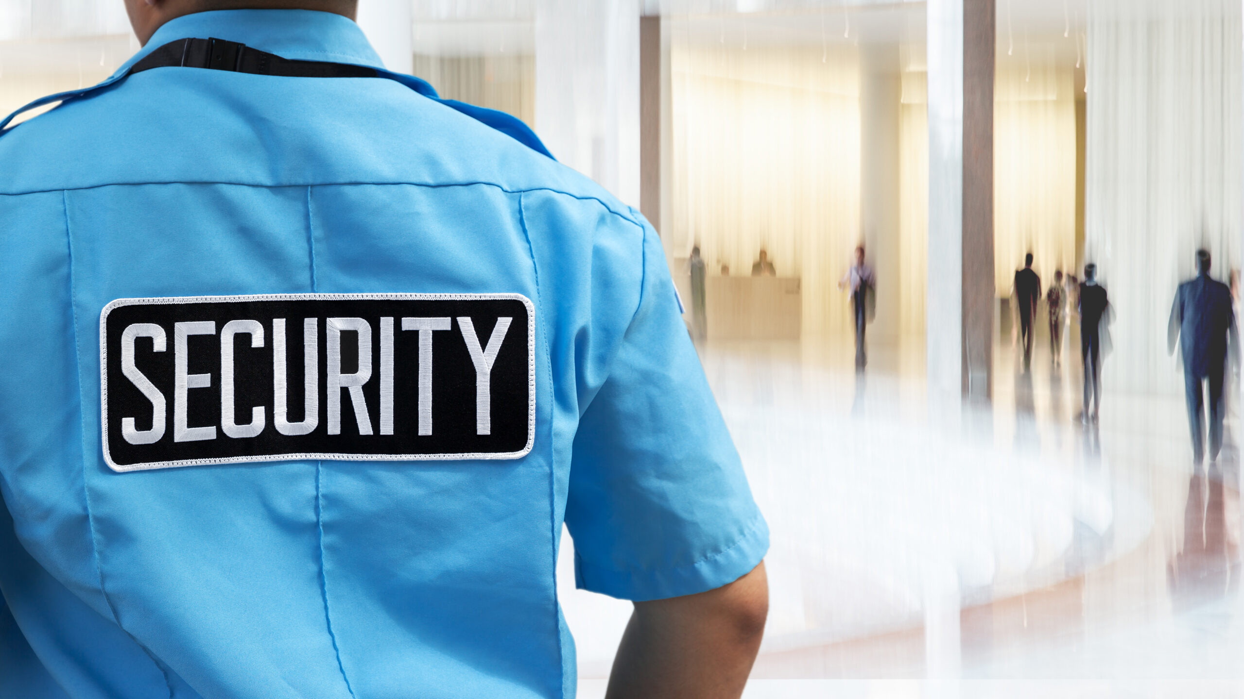 Security guard wears uniform with reflective billboard patch